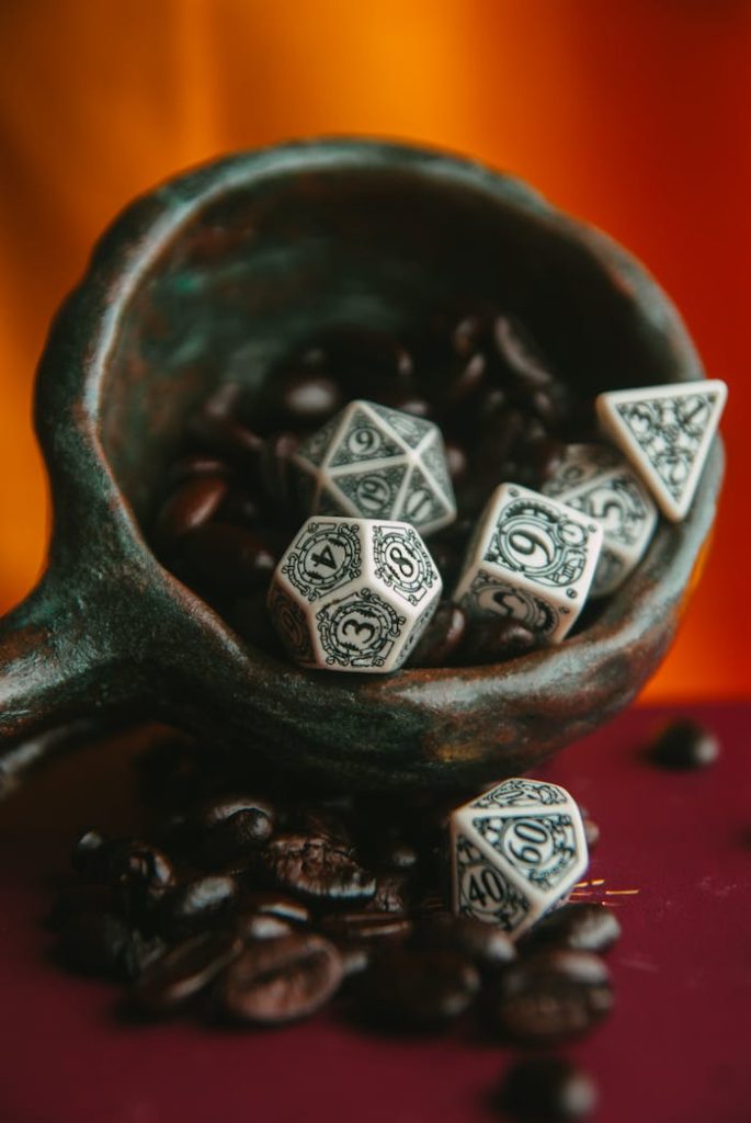 Stylish close-up of ornate dice surrounded by rich coffee beans.